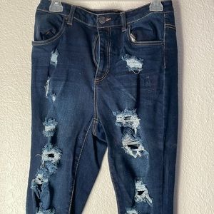 Never worn dark ripped jeans